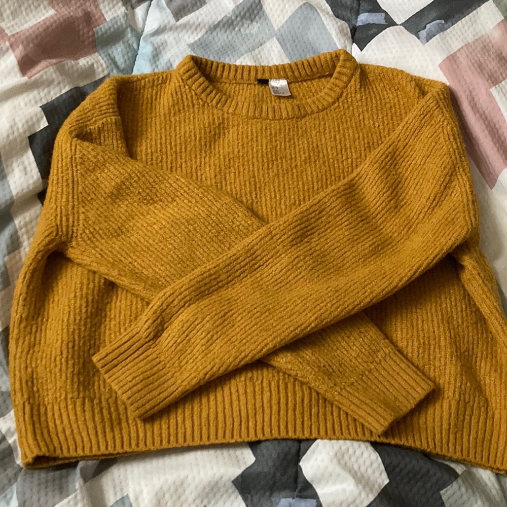 Size small; orangish-yellowish sweater